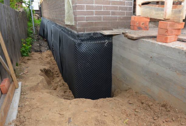 Happy homeowners after waterproofing job in Donnelsville